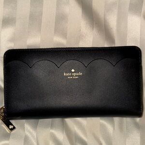 Kate Spade Black Zip-Around Wallet with scalloped edge detail